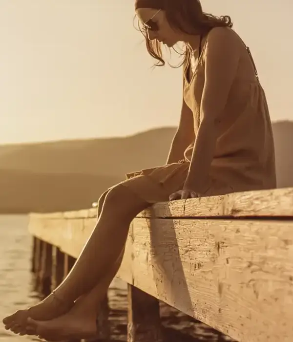 steps together pensive single caucasian pretty young woman sitting pier